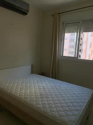 a bed in a room with a window at المنتزه الجديد in Marrakech