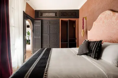 a bedroom with a large bed in a room at Riad Dar Acsameda & Spa in Marrakech