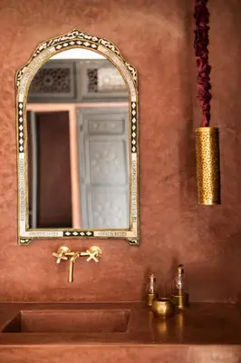 a bathroom with a sink and a mirror at Riad Dar Acsameda & Spa in Marrakech