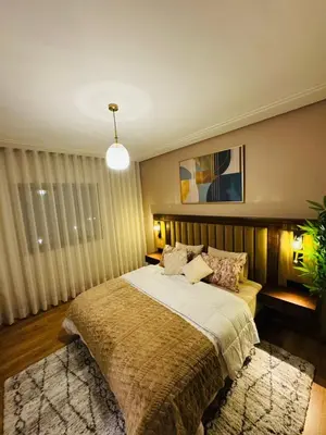 a bedroom with a large bed in a room at Luxury Apartment in Central Marrakech - Pool & Fast Wi-Fi in Marrakech