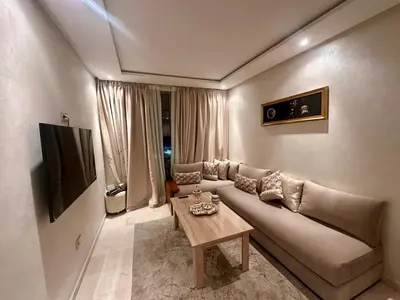 a living room with a couch and a table at Appartement chambre et salon Perle20 Gueliz in Marrakech