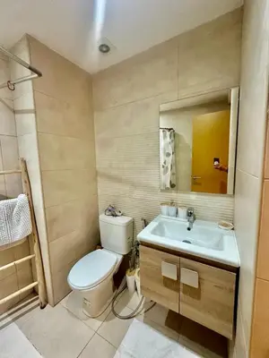 a bathroom with a toilet and a sink at Appartement chambre et salon Perle20 Gueliz in Marrakech