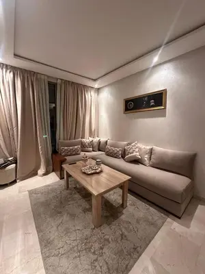 a living room with a couch and a coffee table at Appartement chambre et salon Perle20 Gueliz in Marrakech