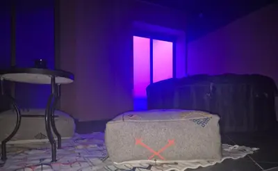 a room with purple and pink lights and a bed at El Méhénni Guéliz JACUZZI 6 Personnes Terrasse Privative in Marrakech