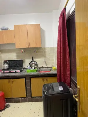 a kitchen with a trash can in a kitchen at Jolie appartement à Marrakech in Marrakech