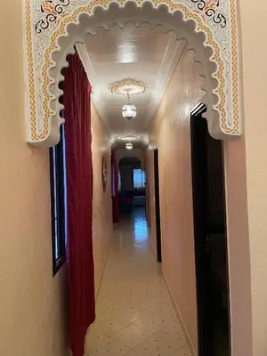a hallway with an archway in a building at Jolie appartement à Marrakech in Marrakech