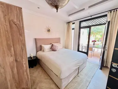 a bedroom with a bed and a large window at Riad in Hotel M Avenue in Marrakech