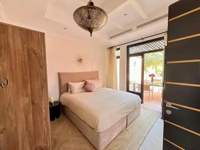 a bedroom with a bed and a large window at Riad in Hotel M Avenue in Marrakech