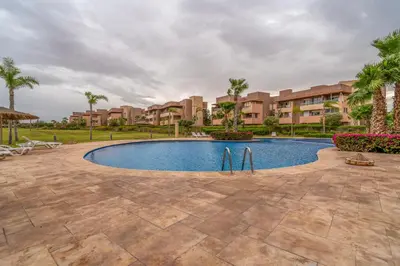 an image of a swimming pool at a resort at Prestigia agate vue sur golf in Marrakech