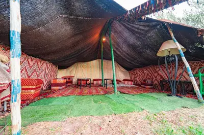 a large tent with chairs and tables in it at Tente berbère in Marrakech