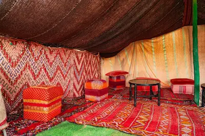 a tent with two chairs and a table in it at Tente berbère in Marrakech