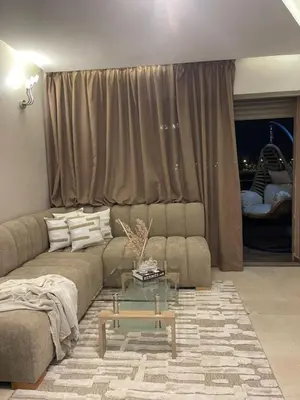 a living room with a couch and a table at Luxueux appartement a Marrakech in Marrakech