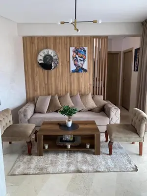 a living room with a couch and a coffee table at Kech Aliouni in Marrakech
