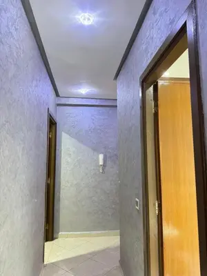 an empty hallway with a door and a mirror at Sunrise Private Apartment in Marrakech