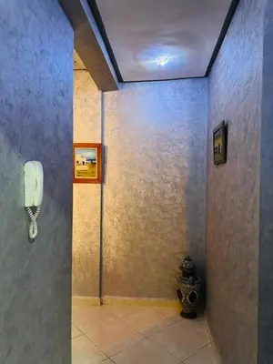 a room with a phone on a wall at Sunrise Private Apartment in Marrakech