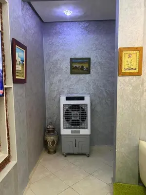 a room with a air conditioner in a wall at Sunrise Private Apartment in Marrakech