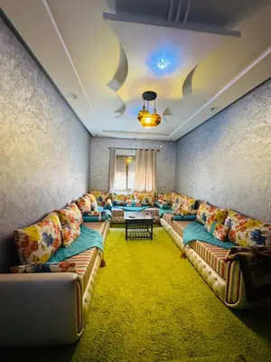 a large living room with couches and a table at Sunrise Private Apartment in Marrakech