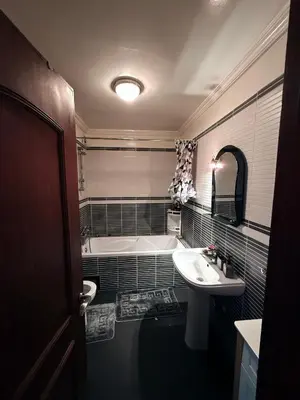 a bathroom with a tub and a sink and a bath tub at Heart of Marrakech in Marrakech