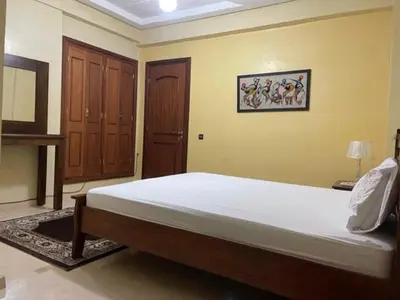 a bedroom with a large bed in a room at Heart of Marrakech in Marrakech