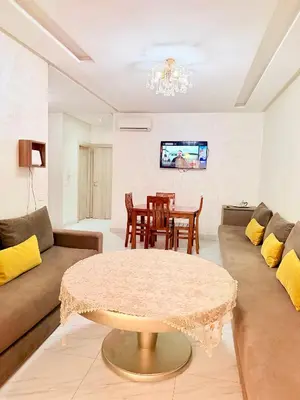 a living room with a couch and a table at Studio De luxe Avec BALCON in Marrakech