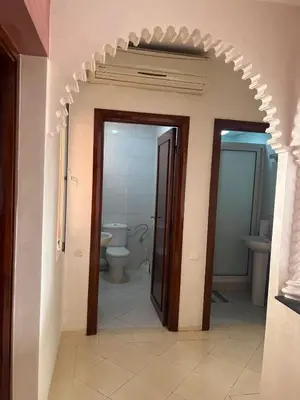an entrance to a bathroom with a toilet and a doorway at Calm & Cozy Studio with Balcony in Marrakech