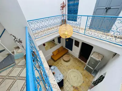 an overhead view of a living room with a balcony at Riad bleu 4 in Marrakech