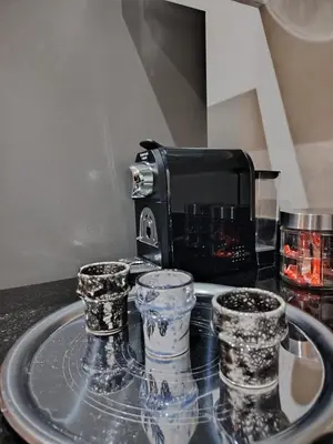 a kitchen counter with two cups and a toaster at Modern apartement in Hivernage in Marrakech
