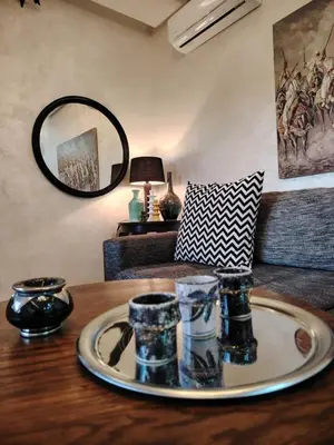 a table with a plate on top of a table at Modern apartement in Hivernage in Marrakech