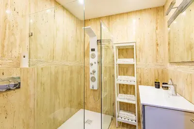 a bathroom with a shower and a sink at New! Apt jacaranda, wifi and parking in Marrakech