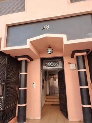 an entrance to an office building with a sign on it at Dream stay 5 swimming pools for family in Marrakech