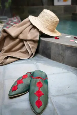 a hat and a pair of shoes with hearts on them at Riad O'Zeen in Marrakech