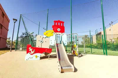 a playground with a slide and a slideintend at Livia cosy - Clim, Wifi, Jardin à 10min de l'Aéroport in Marrakech
