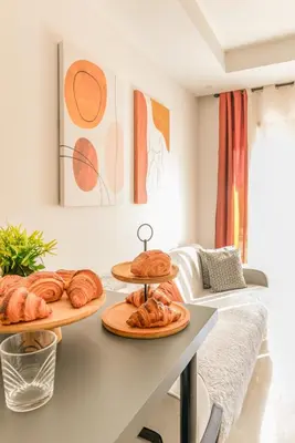 two plates of pastries on a table in a living room at Maeva cosy - Clim, Wifi, Jardin à 10min de l'Aéroport in Marrakech