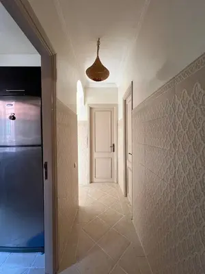 a hallway with a white door and a ceiling at Dali apartment in Marrakech