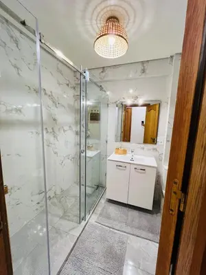 a bathroom with a shower and a sink at Appartement Centre de Gueliz in Marrakech