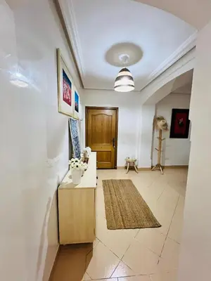 a living room with a couch and a table at Appartement Centre de Gueliz in Marrakech