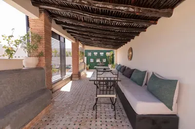a living room with a couch and a table at Riad Dar Bousga in Marrakech