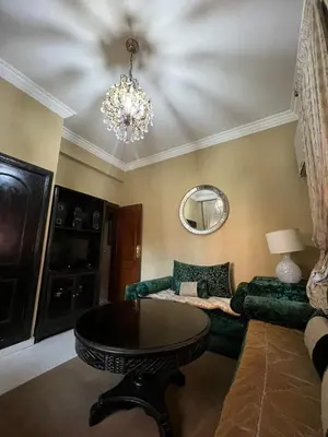 a living room with a couch and a table at Appartement familiale et traditionnel in Marrakech