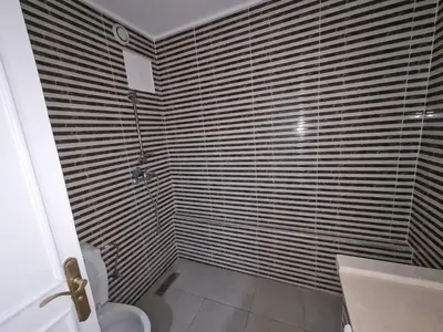 a bathroom with a shower and a toilet in it at résidence ATLASS in Marrakech