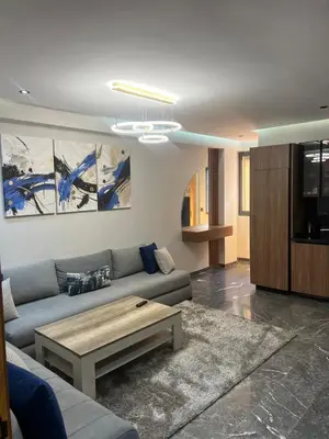 a living room with a couch and a coffee table at elite garden appartment in Marrakech