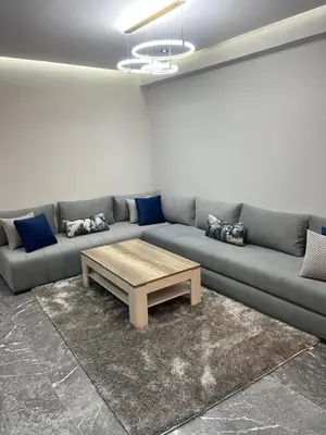 a living room with a couch and a coffee table at elite garden appartment in Marrakech