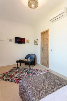 a living room with a couch and a table at Abraj Bladi Resort in Marrakech