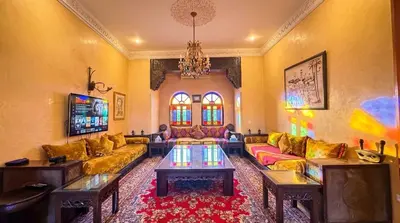a living room with couches and a chandelier at Charming Luxury Villa - Pool & Hot Tub in Marrakech
