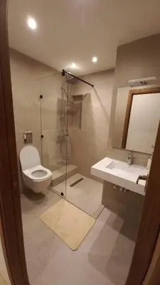 a bathroom with a shower and a toilet and a sink at Appartement proche Gueliz in Marrakech
