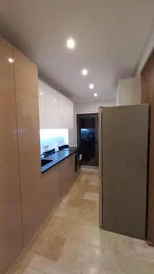 a kitchen with a stainless steel refrigerator in a room at Appartement proche Gueliz in Marrakech