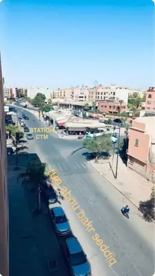 a view of a street with cars parked on the road at Appartement proche Gueliz in Marrakech