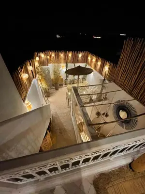 an overhead view of a building with a table at Riad El Charsa, logement entier 4 à 6 personnes, proche Jemaa El Fna, Rooftop et bassin chauffé in Marrakech