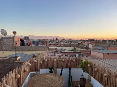 a view of a city from a balcony at Riad El Charsa, logement entier 4 à 6 personnes, proche Jemaa El Fna, Rooftop et bassin chauffé in Marrakech
