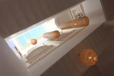 an overhead view of a staircase with several wooden baskets at Riad El Charsa, logement entier 4 à 6 personnes, proche Jemaa El Fna, Rooftop et bassin chauffé in Marrakech
