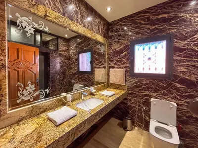 a bathroom with a sink and a mirror at Villa Caprice Palace in city center in Marrakech